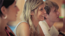 In inspirational video about a college girl who spends her with friends day in Barcelona with friends at the beach, at the market and swimming to top off the day.