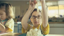 Life of Our Kitchen picture of a boy making a cake. The video shows 30 years of events in the kitchen.