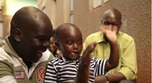 Ugandan father separated from his son is reunited via Skype and has a family portrait to celebrate.