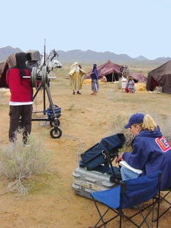 Ginger Stephens looking at the monitor as she directs the filming of the life of Biblical Abraham